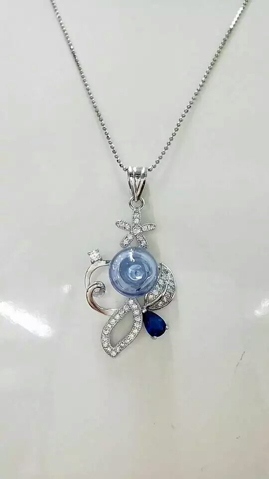 Wholesale fashonal new style flower alloy frame essencial oil light blue bottle diffuser necklace